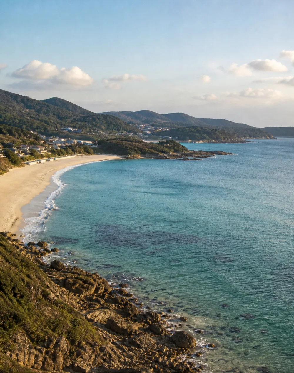 The blue-green sea, beach and wooded coastline of Itoshima near Fukuoka