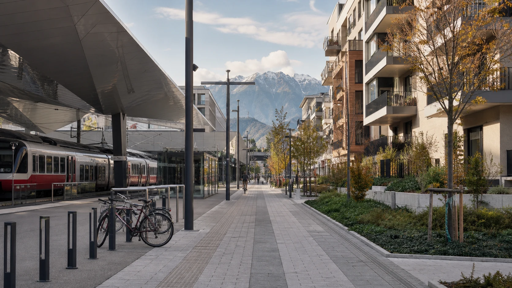 Innsbruck rail and tram access beside residential streets and the mountains