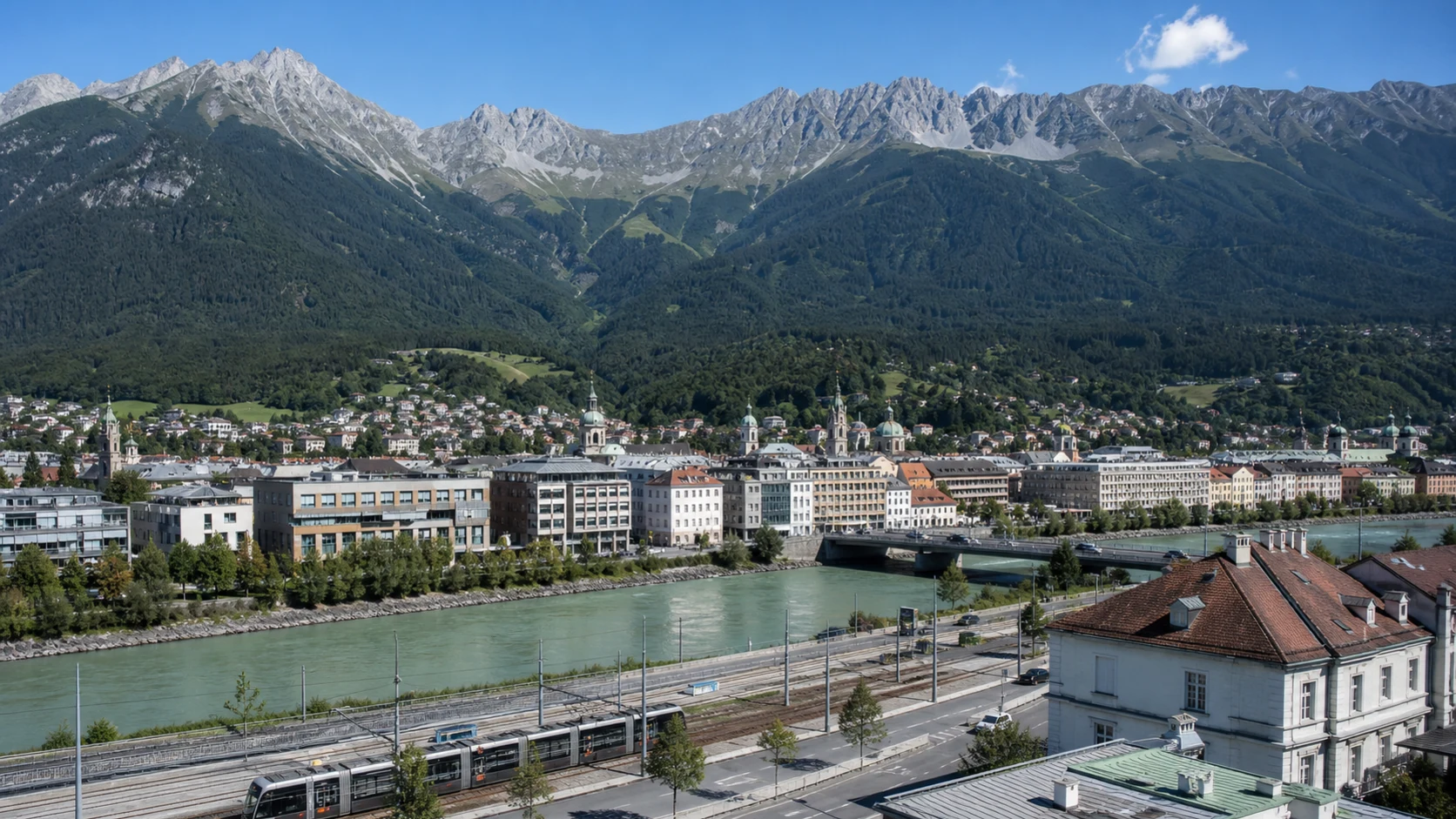 Innsbruck beside the Inn with rail and the Nordkette beyond