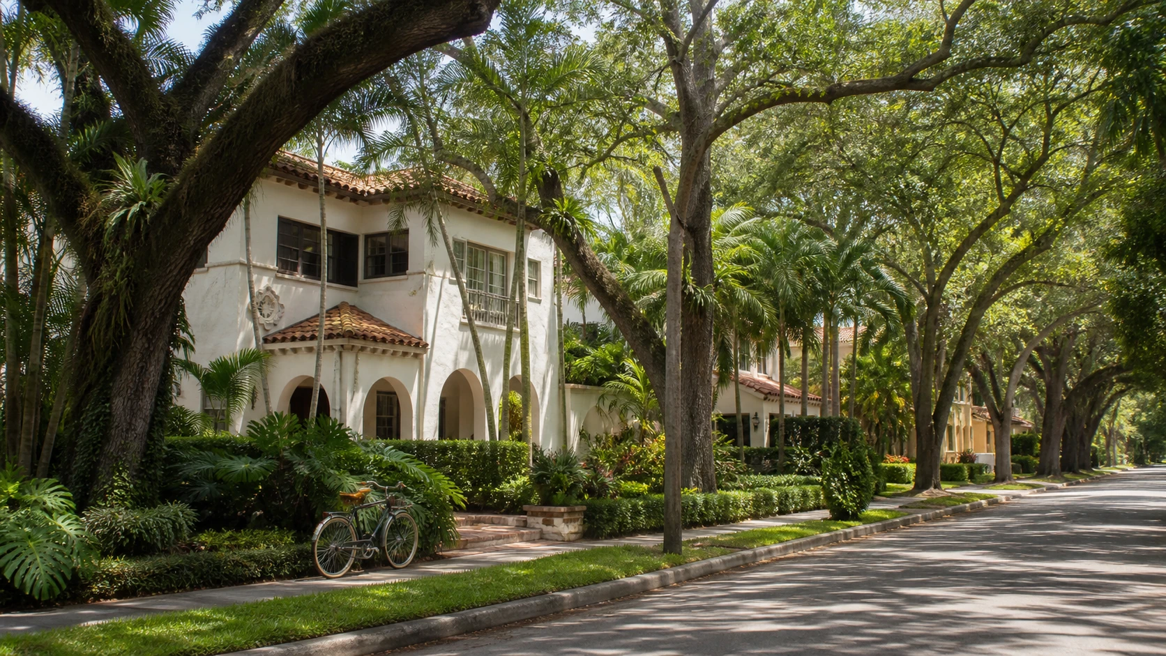 Coral Gables Mediterranean Revival home on a shaded residential street