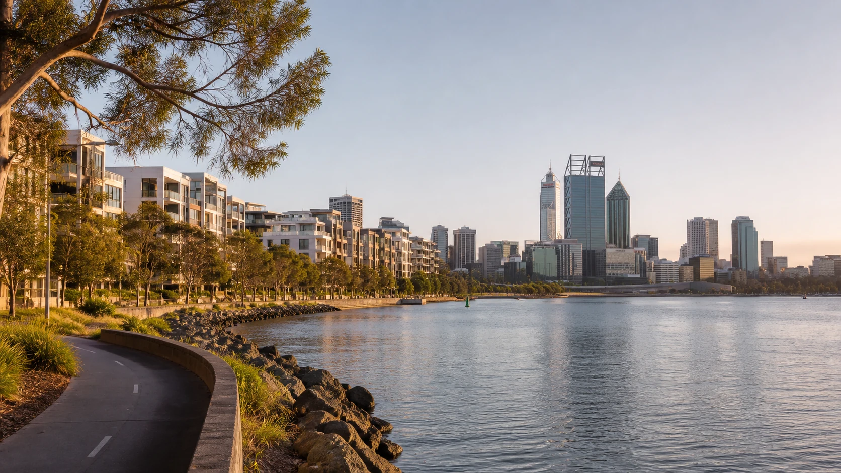 Swan River foreshore, contemporary apartments and the Perth skyline in early-morning light
