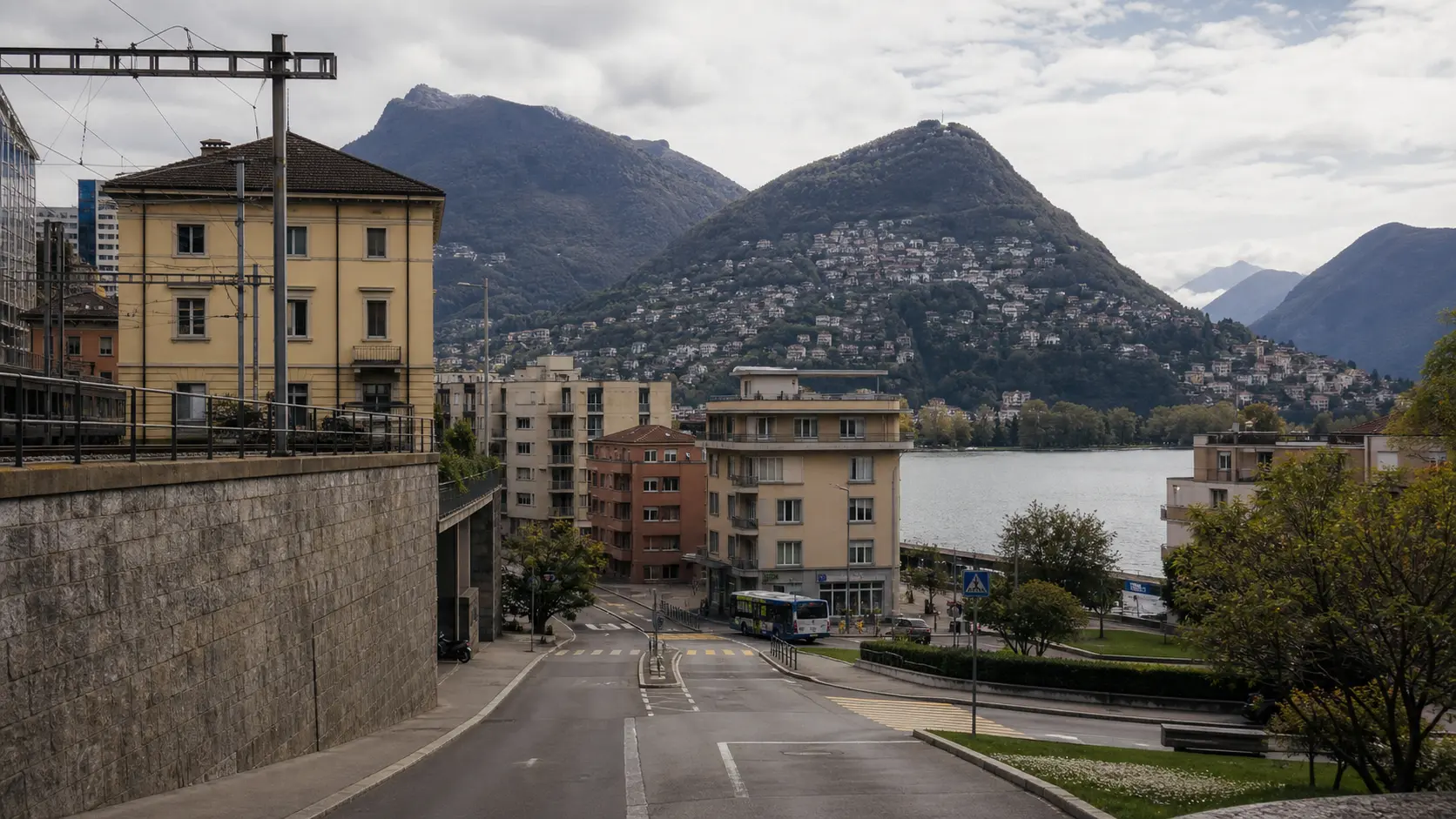 Lugano station district and city streets descending toward Lake Lugano